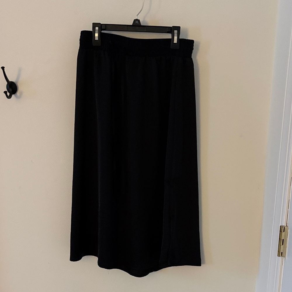 Black “a new day” skirt, size small.